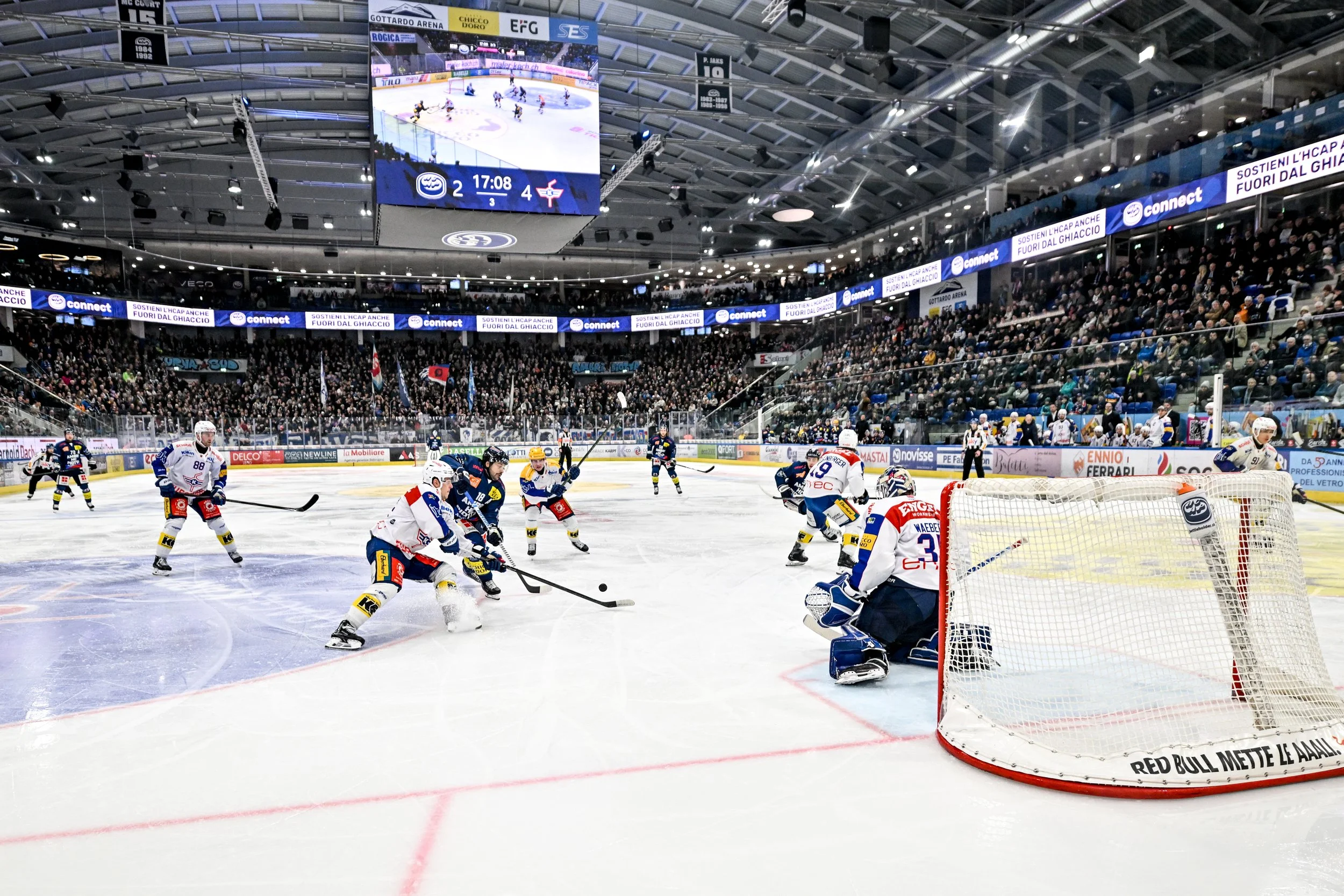  Ambrì Piotta and Kloten battle for possession in the slot 