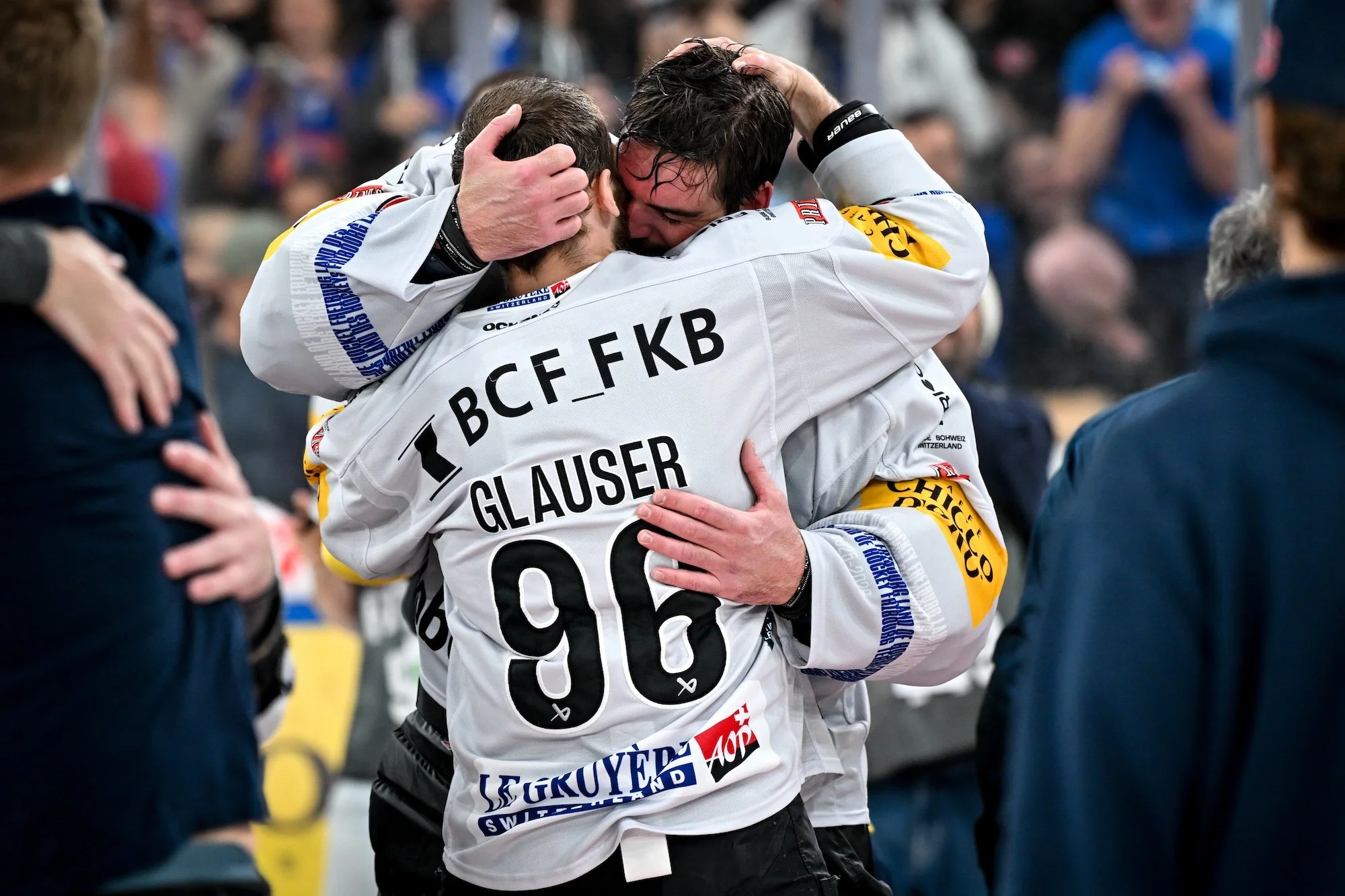  Defenseman Andrea Glauser and goaltender Reto Berra share a hug after the win 