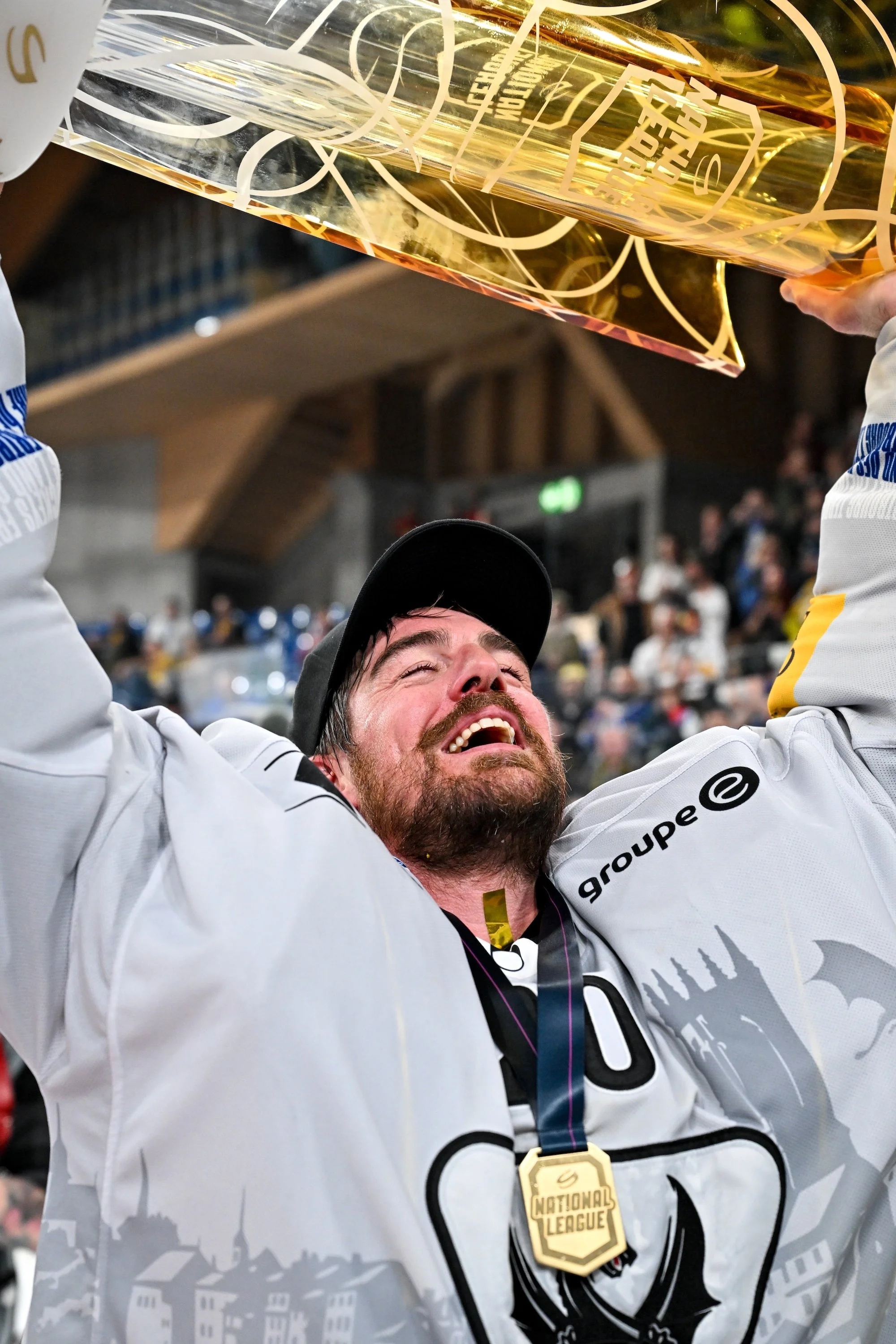  The sheer joy of goaltender Reto Berra as he lifts the Swiss championship trophy for the first time 