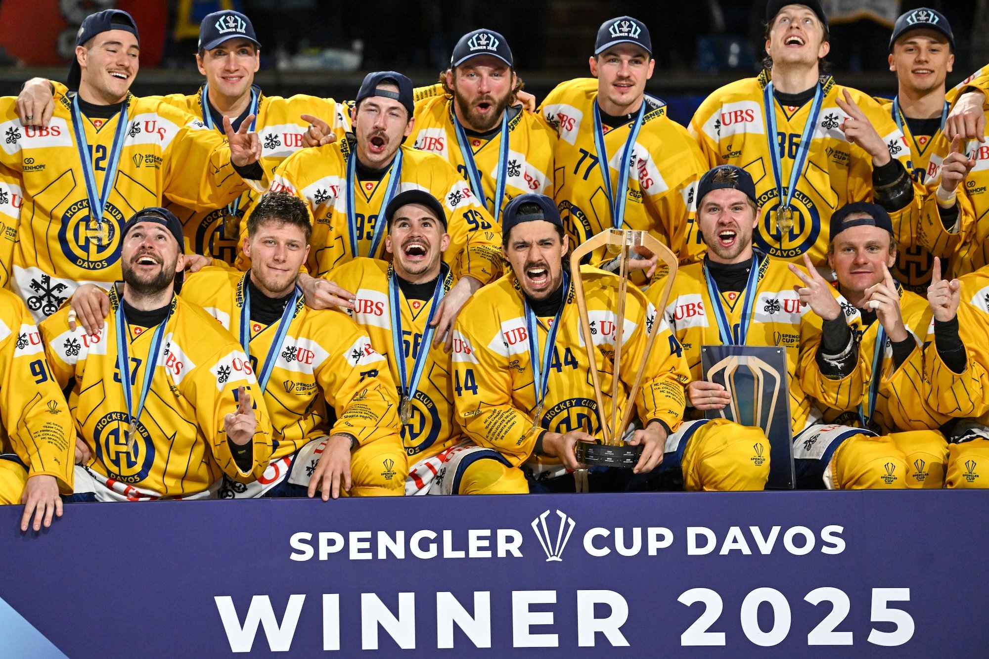 Captain Matej Stransky poses with his teammates and the Spengler Cup after the victory 