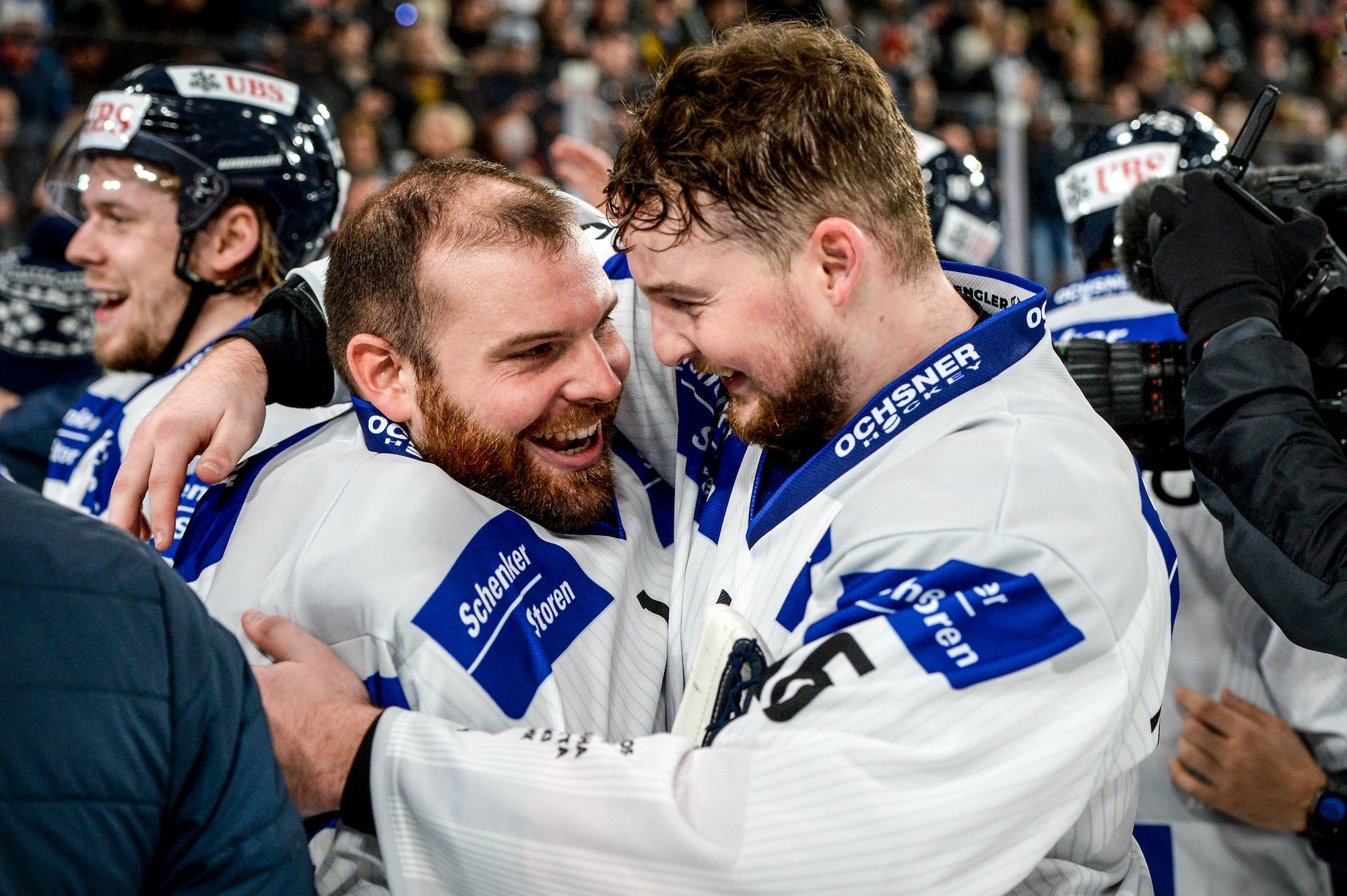  Benjamin Conz and Dominic Zwerger share an embrace after winning the Spengler Cup 