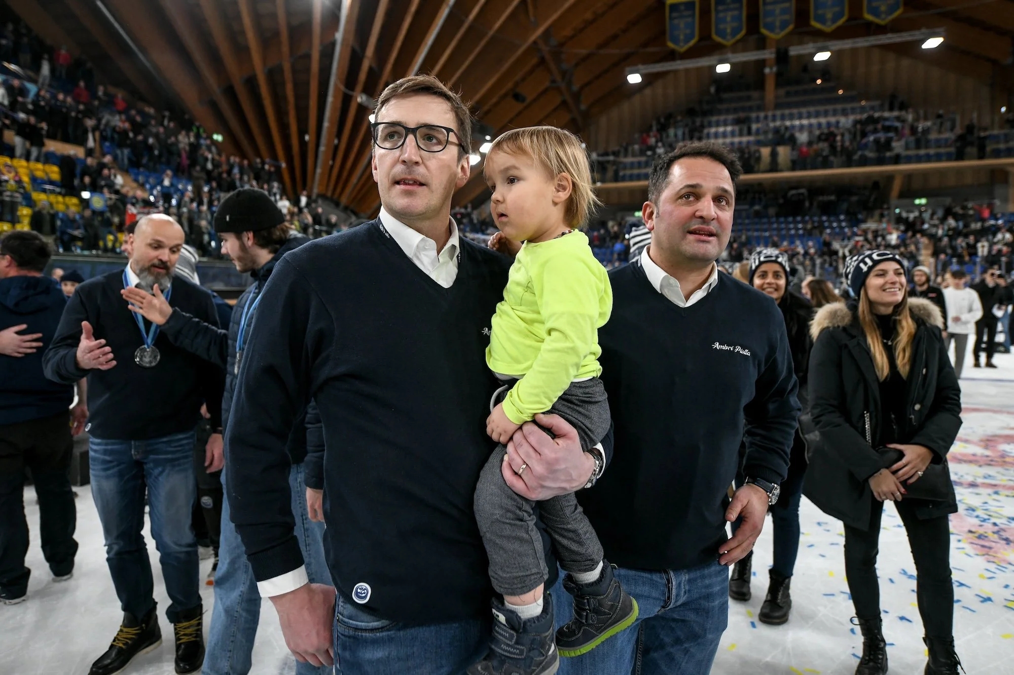  Head coach Luca Cereda and GM Paolo Duca are visibly emotional, with tears in their eyes 