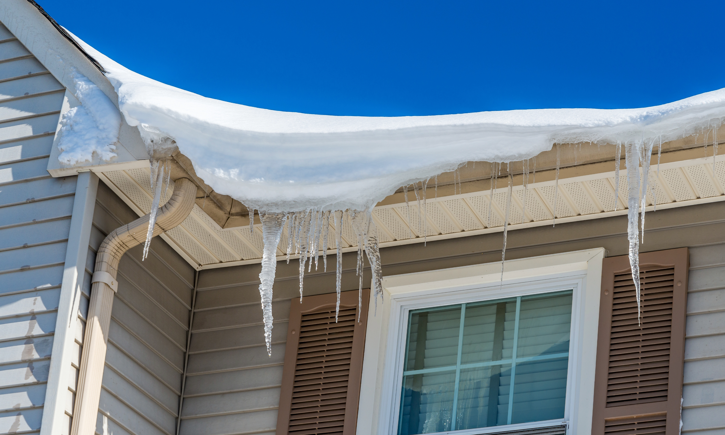 Keeping Your Roof Clear to Prevent Snow Damage