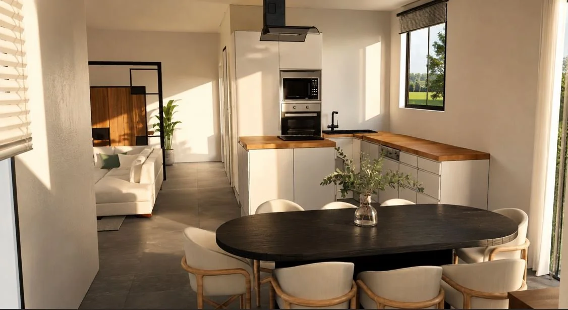 Cuisine moderne avec plan de travail en bois, salle à manger avec table ovale noire et huit chaises beige, vue sur un salon avec canapé blanc et plante verte, fenêtre offrant une vue sur la nature.