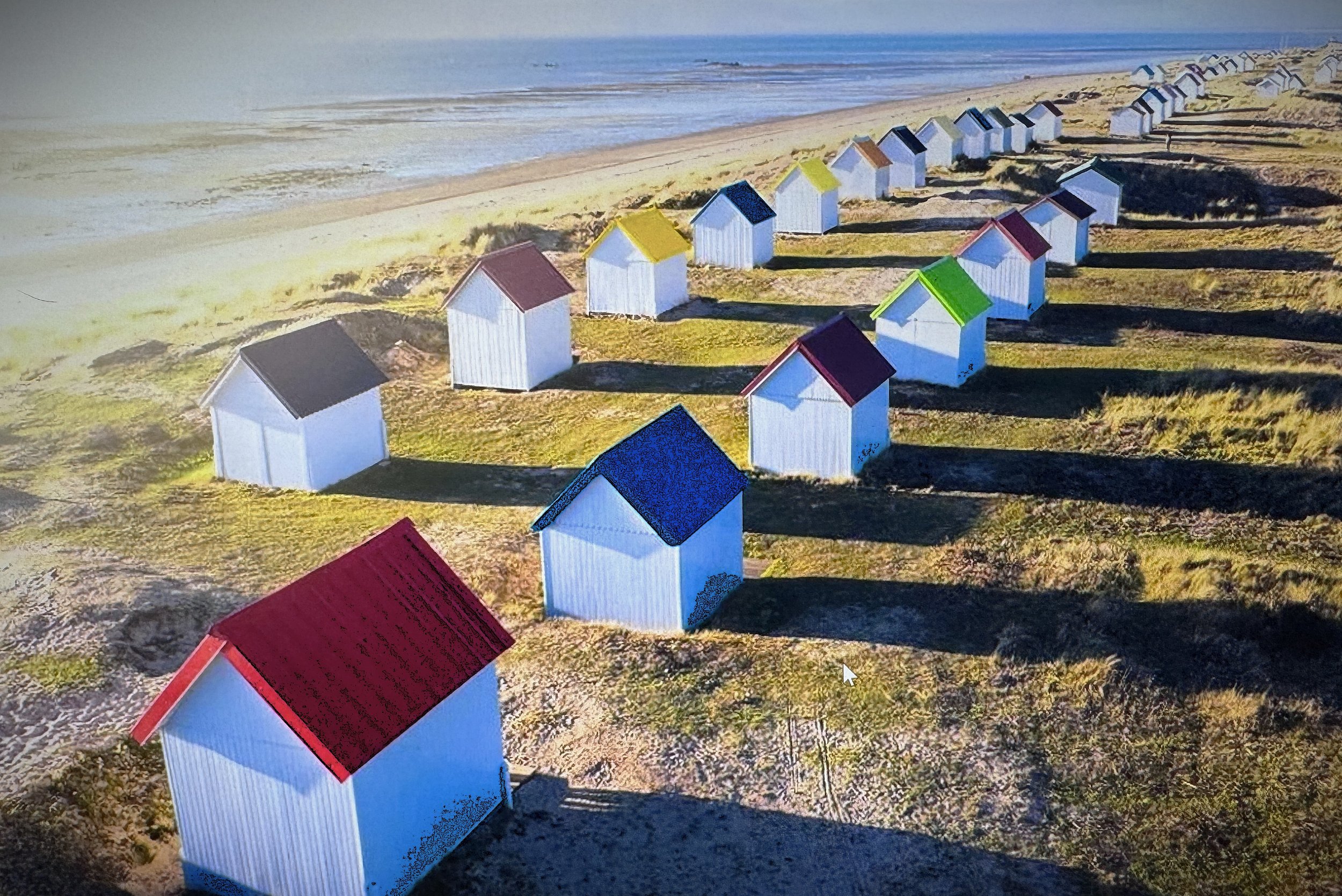 Traditional beach huts at Gouville-sur-Mer
