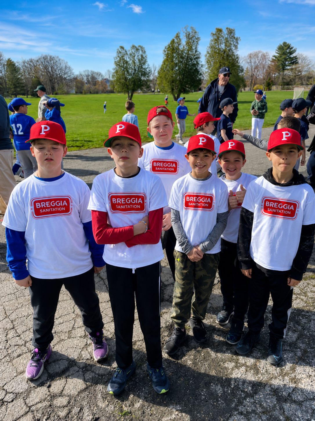 A group of happy little league players wearing Breggia sponsored uniforms