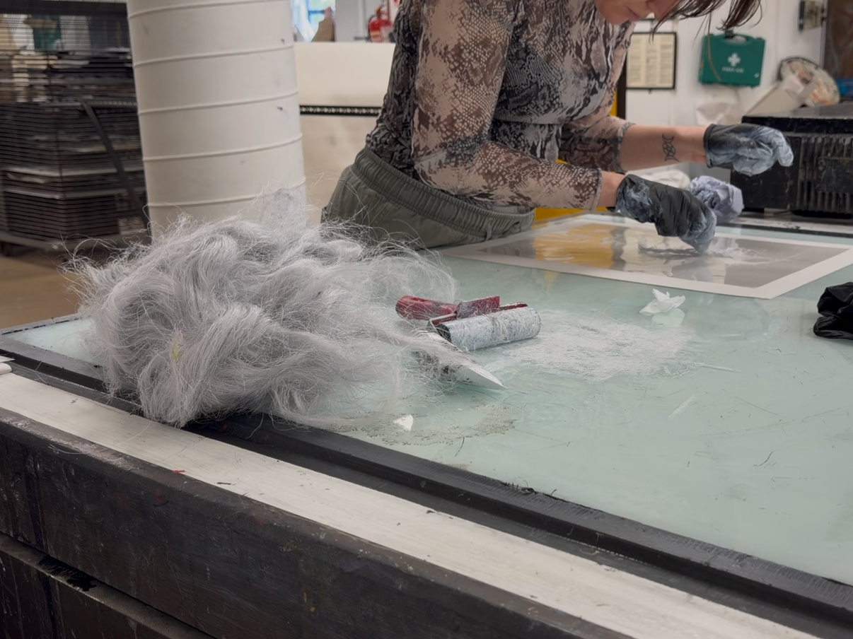 Image of artist printmaking in the workshop at NCAD
