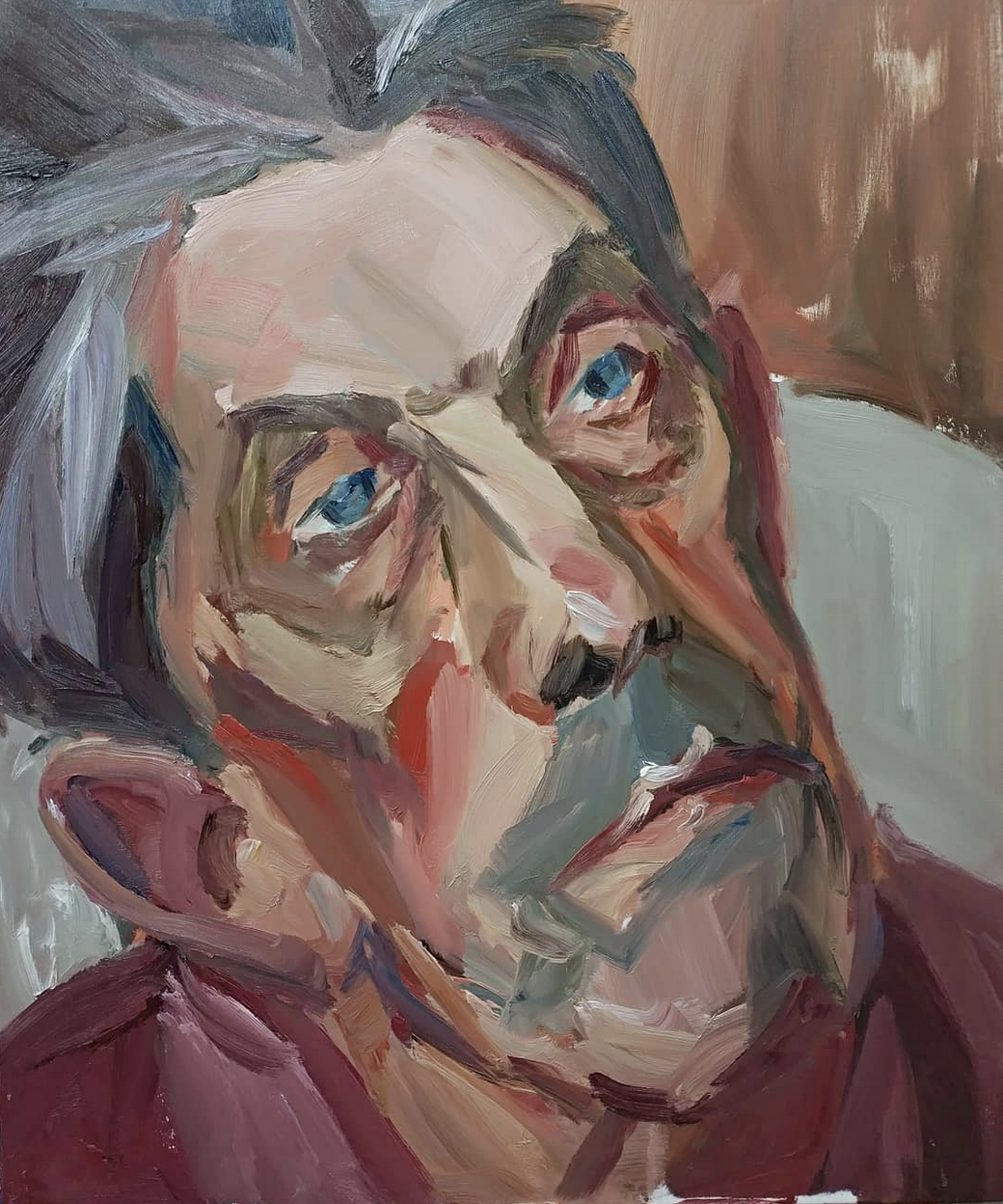 A colorful abstract painting of a person with glasses resting their head on a hand, with a smile and bright blue eyes.