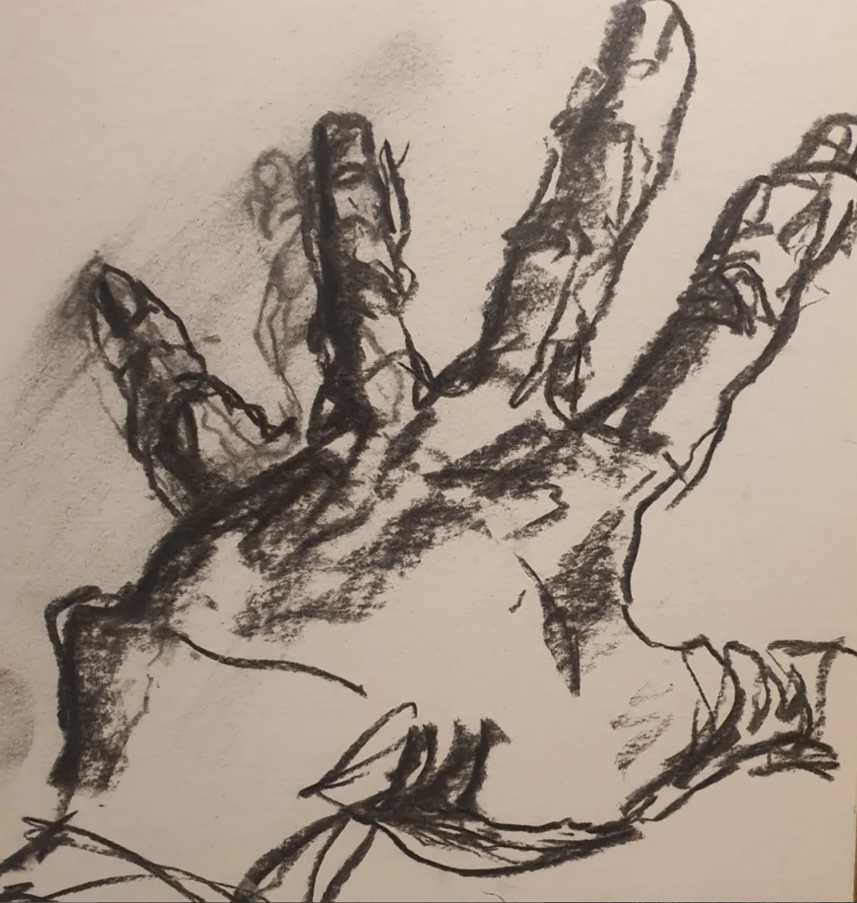 Sketch of a hand with outstretched fingers, drawn with black charcoal or pencil.