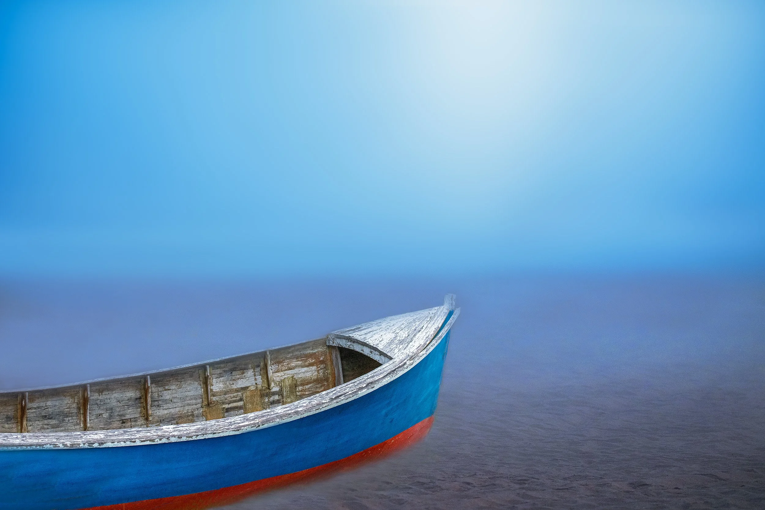 Boat on Foggy Beach