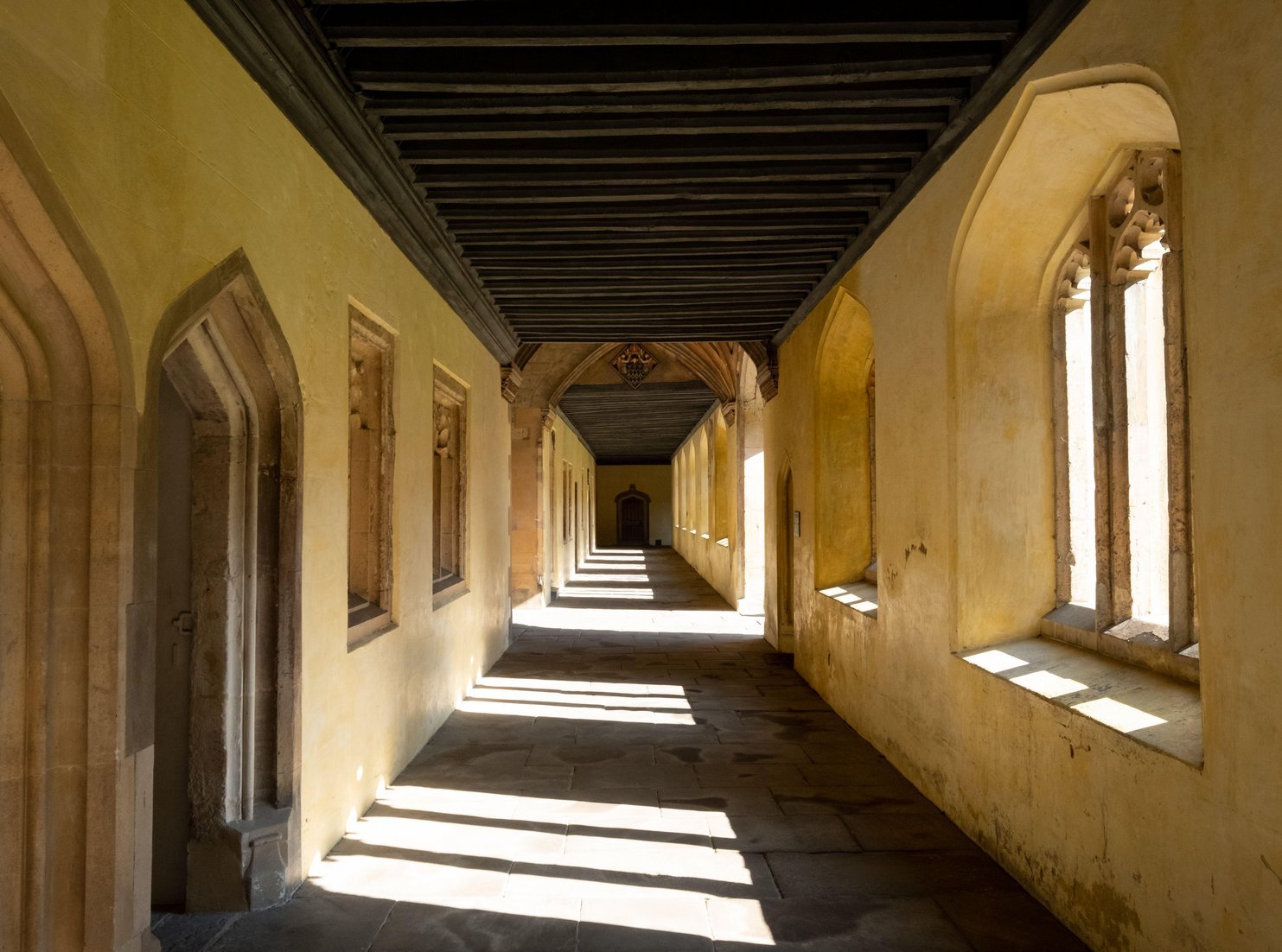 Magdalen College cloisters passageway in Oxford reflecting perspective, continuity, considered judgement and long duration thinking