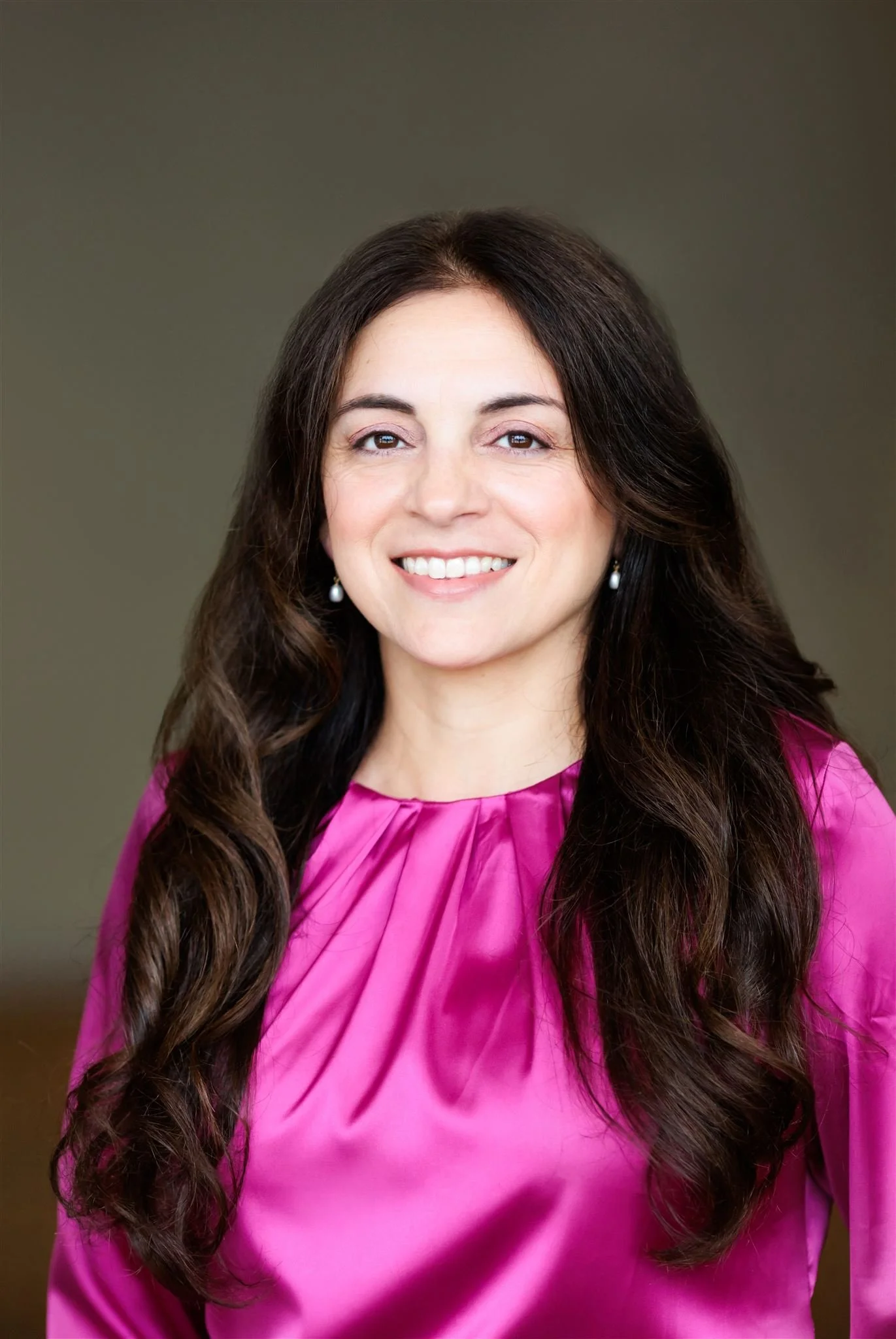 Headshot of Dr. Amanda Reyes wearing pink top