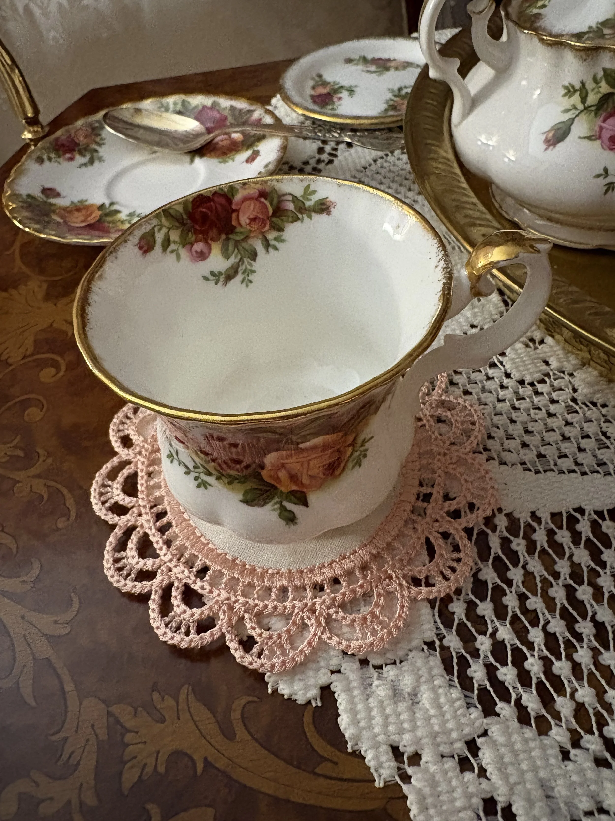 Cameo Lace Accent Mat teacup display.jpeg