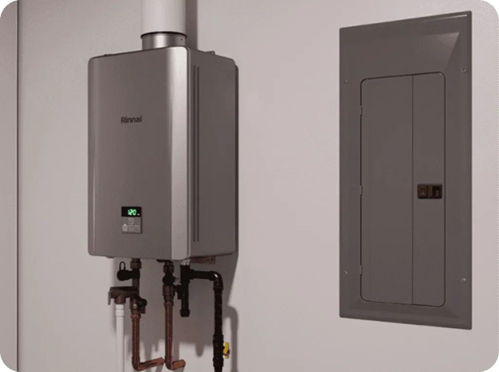 A Rinnai tankless water heater installed on a wall, with pipes connected at the bottom, next to an electrical panel.