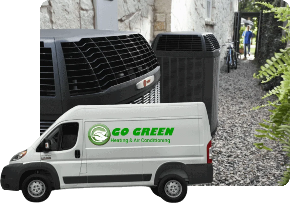 A white HVAC service van with green logo and text reading 'GO GREEN Heating & Air Conditioning,' parked outdoors next to two large black air conditioning units.