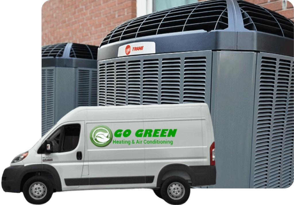 A logo on a white service van reading "Go Green Heating & Air Conditioning" parked in front of large outdoor HVAC units.