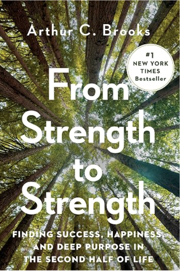 Book cover for 'From Strength to Strength' by Arthur C. Brooks features an upward view of tall trees with green leaves, sunlight shining through.