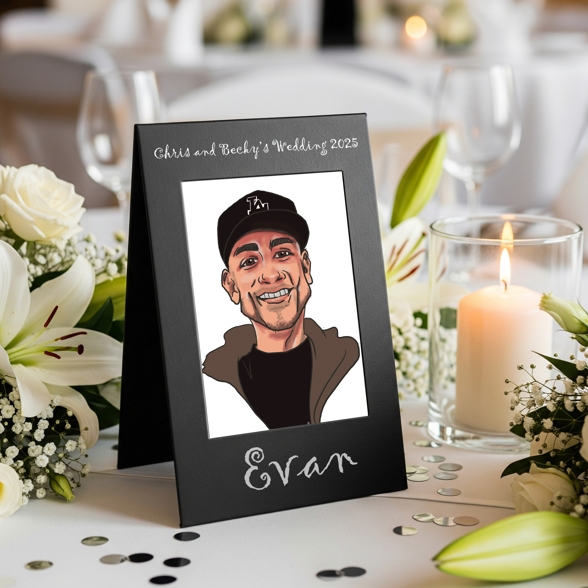 A printed caricature of a smiling man wearing a baseball cap, displayed on a black frame with white text reading "Chris and Becky’s Wedding 2025," surrounded by white flowers and candles at a wedding reception table.