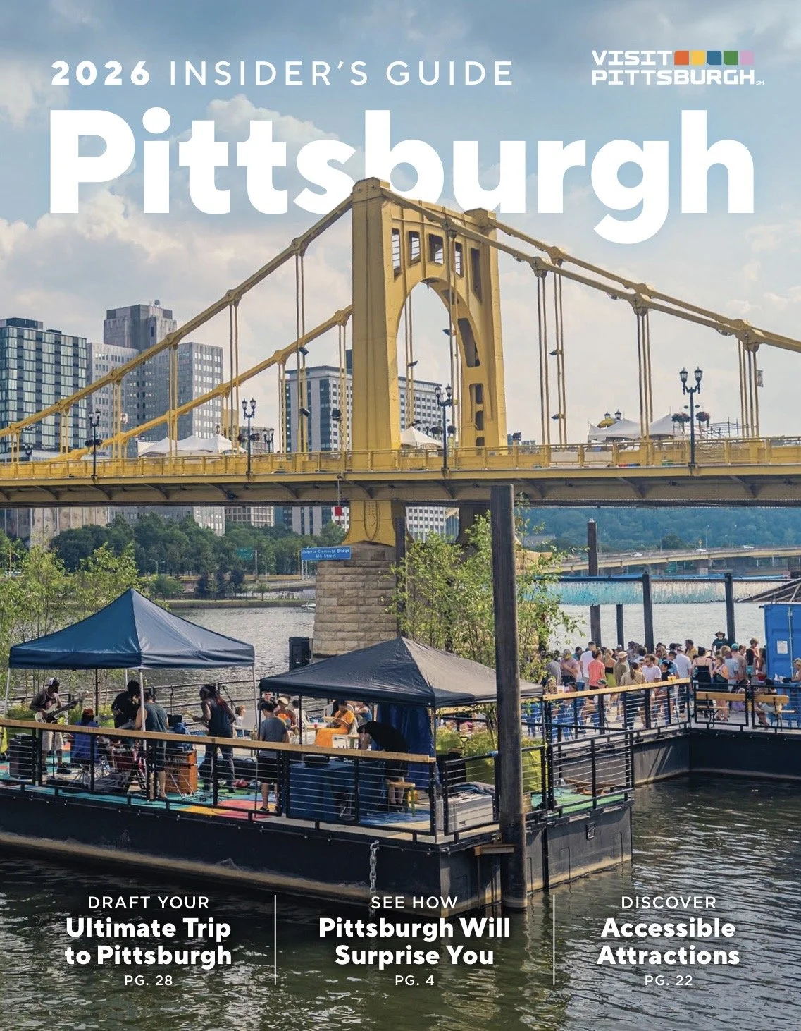 The cover of the 2026 Insider's Guide to Pittsburgh showing a yellow suspension bridge over a river with a crowd of people enjoying outdoor activities along the riverbank.