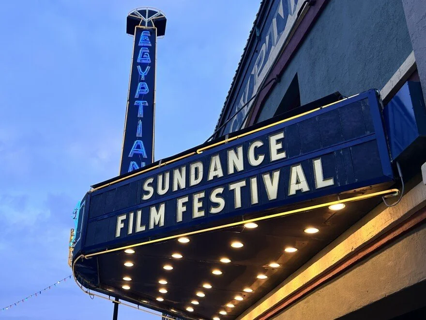 Marquee sign for the Sundance Film Festival with the word 'Egyptian' vertically lit up on a sign above.