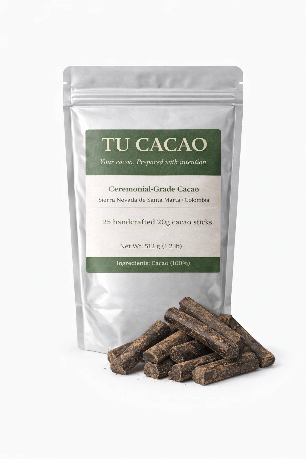 A silver resealable pouch of TU CACAO Ceremonial-Grade Cacao from Sierra Nevada de Santa Marta, Colombia, with a pile of dark cacao sticks in front.