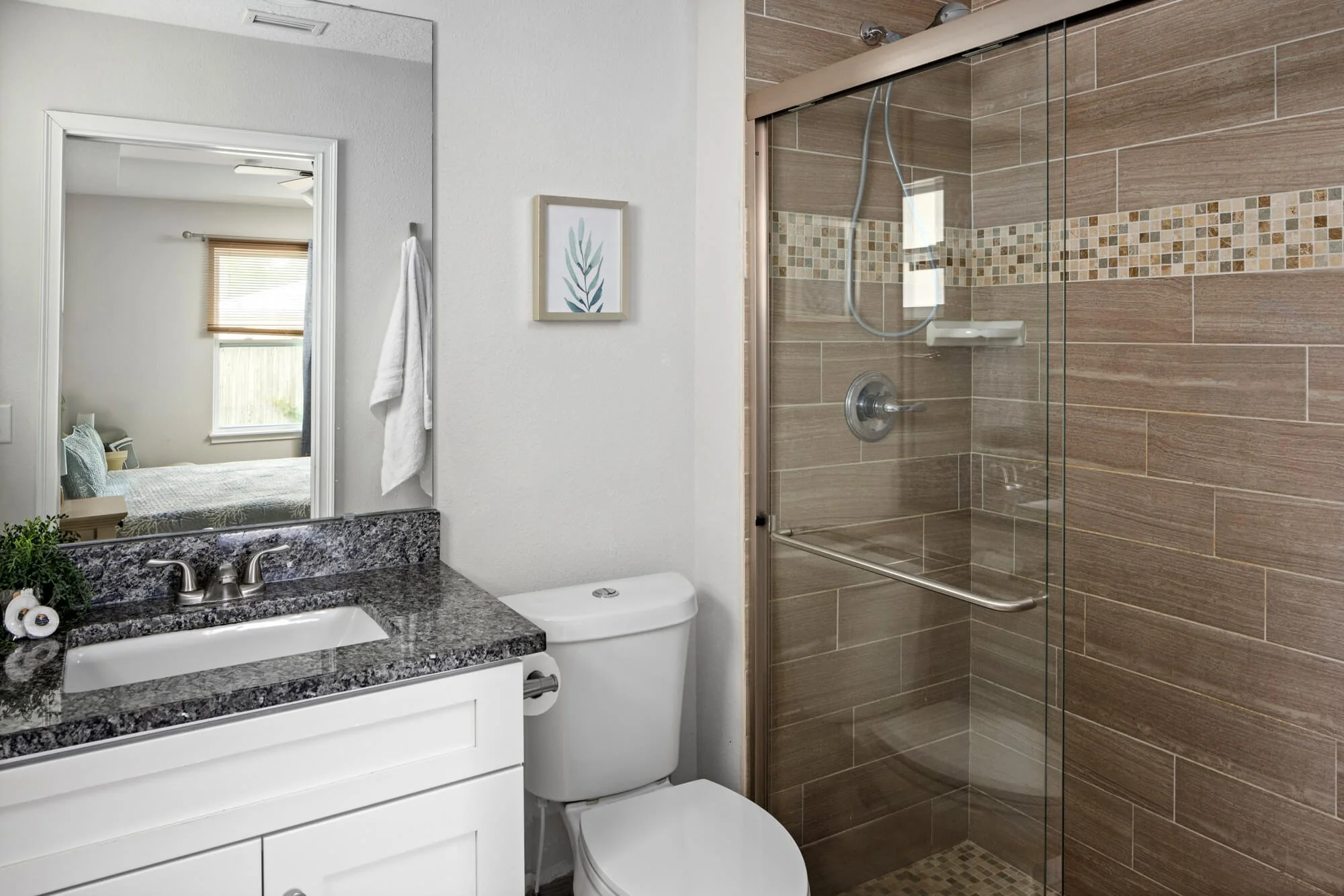 Ensuite bathroom with glass walk-in shower and granite vanity