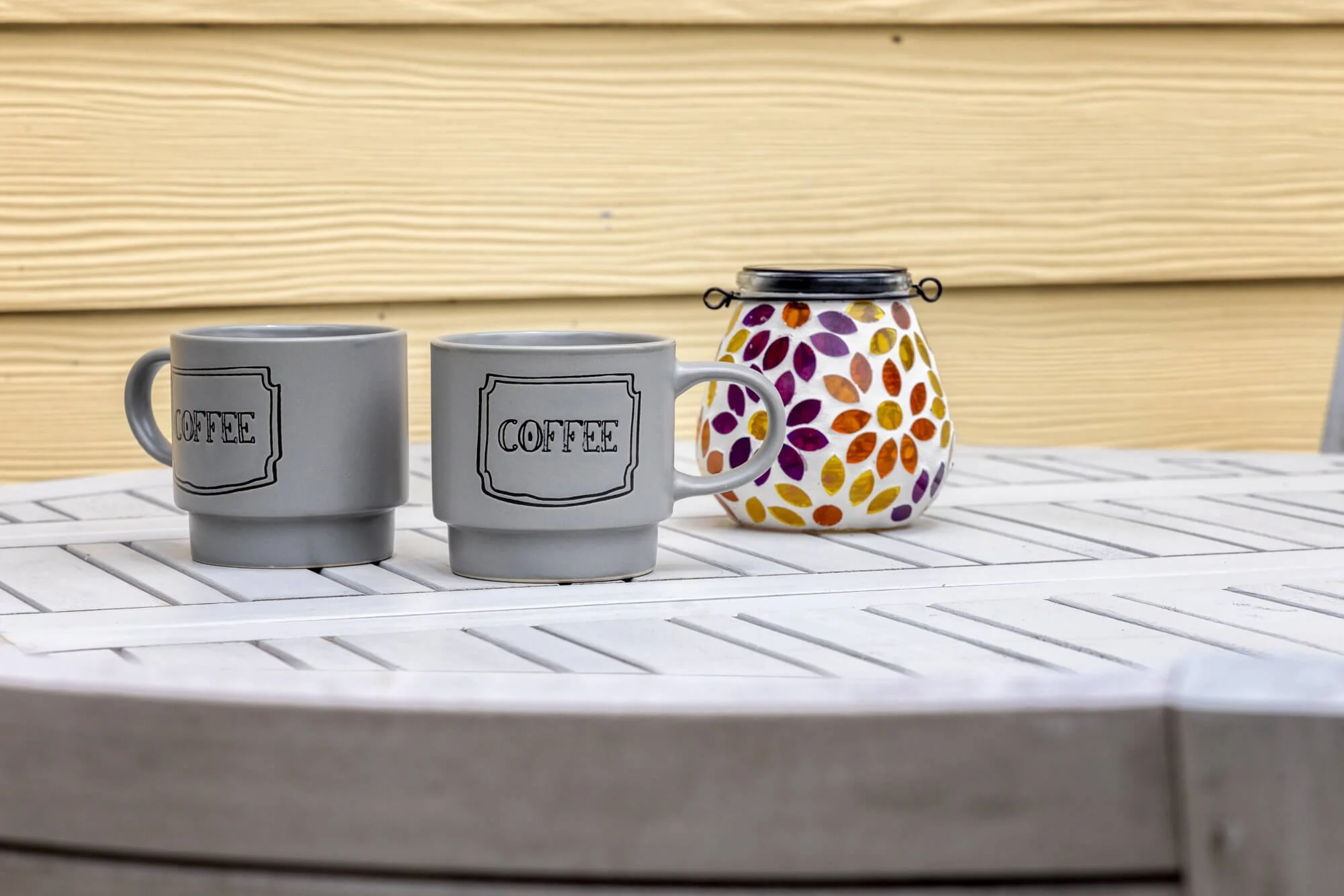 Coffee mugs on the outdoor patio table