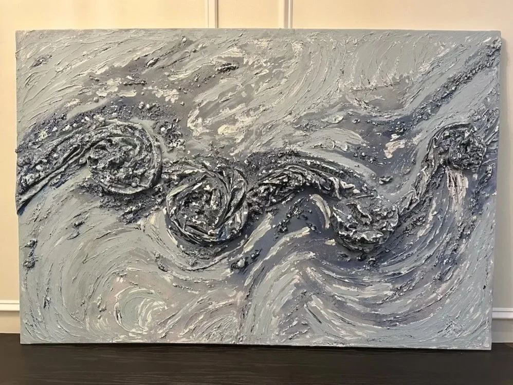 Textured abstract painting in black, white, and gray tones, resembling a swirling ocean with waves and rocks