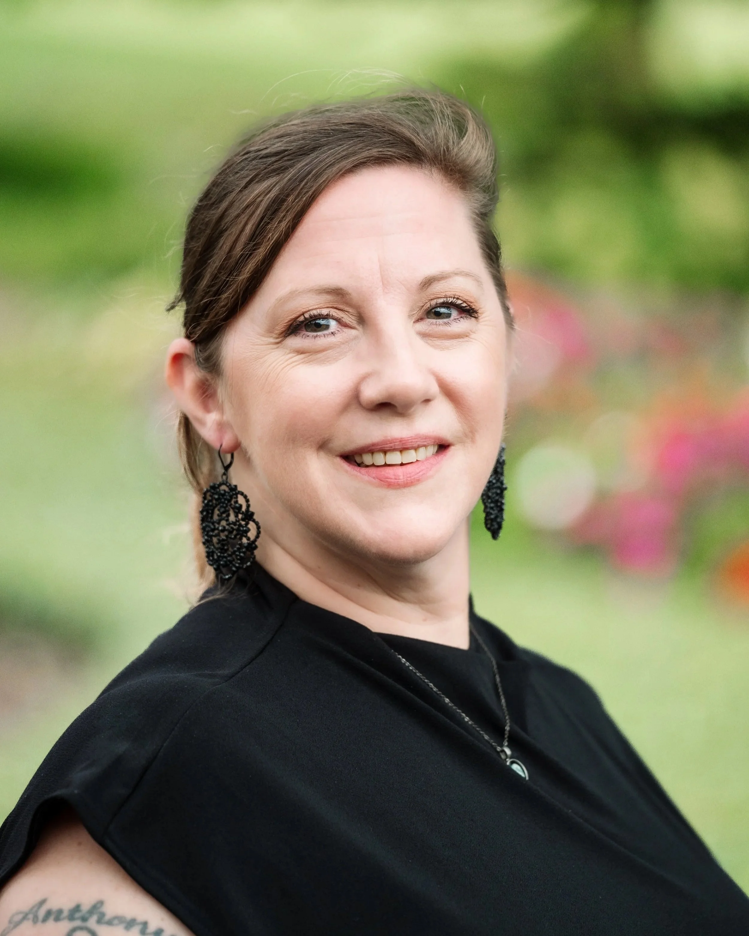 Jessica Carroll, leadership team member at Healthy Minds Therapy, smiling in a professional portrait.