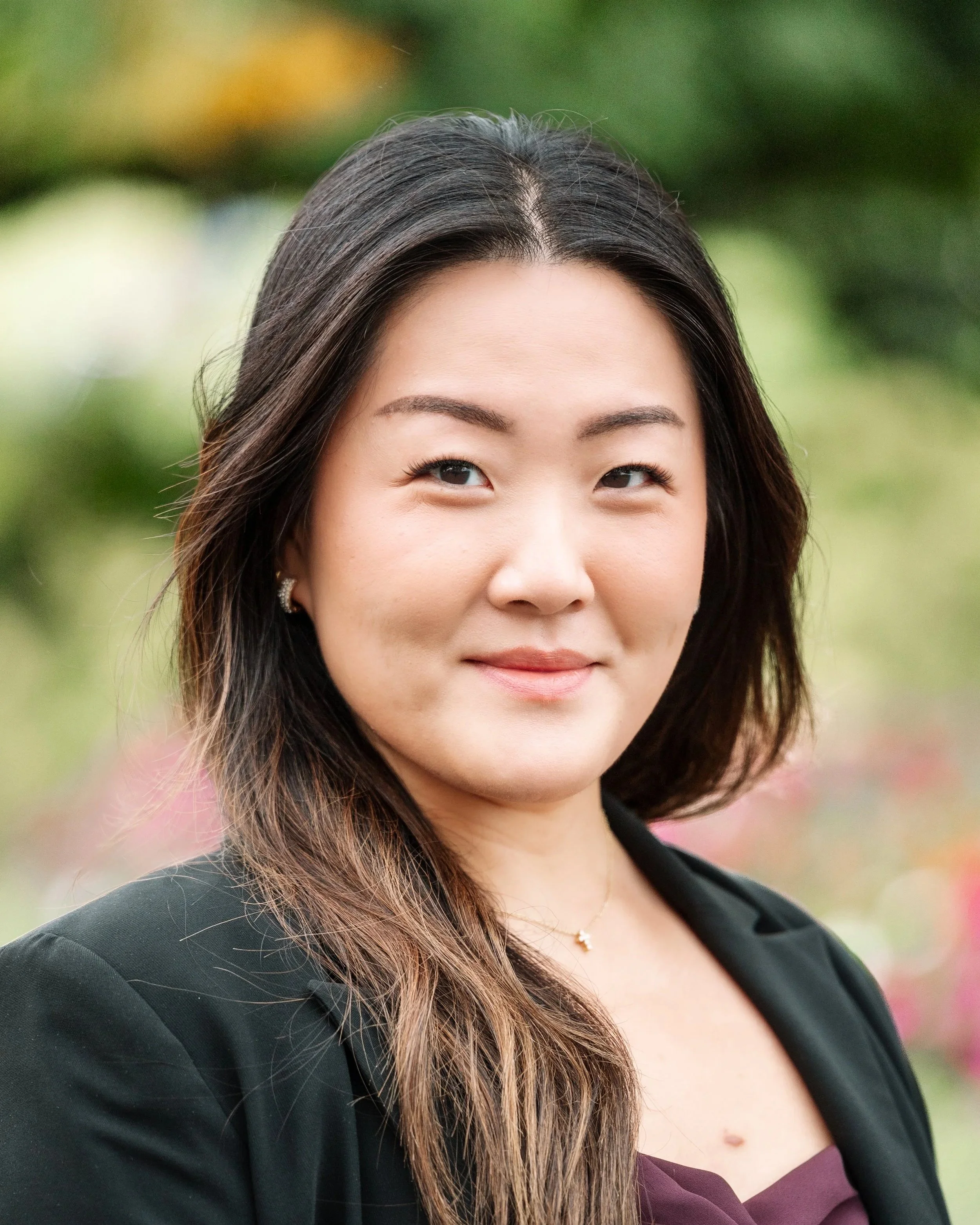 Grace Kim, Clinical Supervisor at Healthy Minds Therapy, smiling in a professional portrait.