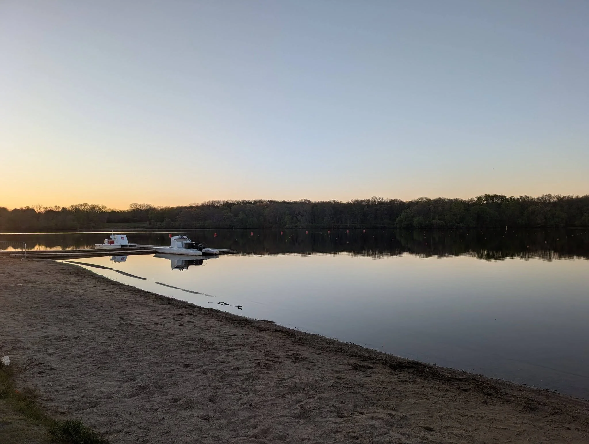 Rowing launch boats get ready to head out before a regatta at Kent Lake in Milford, Michigan's Kensington Metropark.