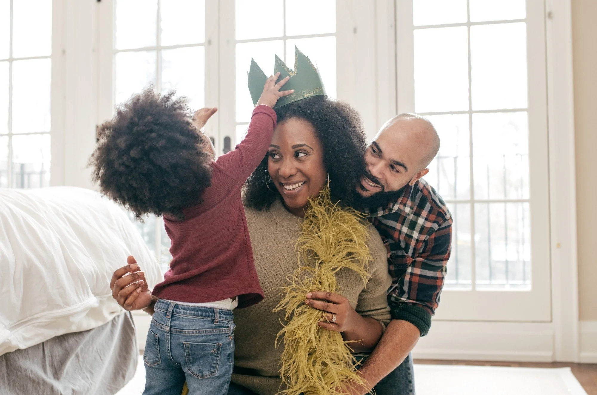 A happy family playing together during a personalized caregiver training and family support session in Davidson County, NC.