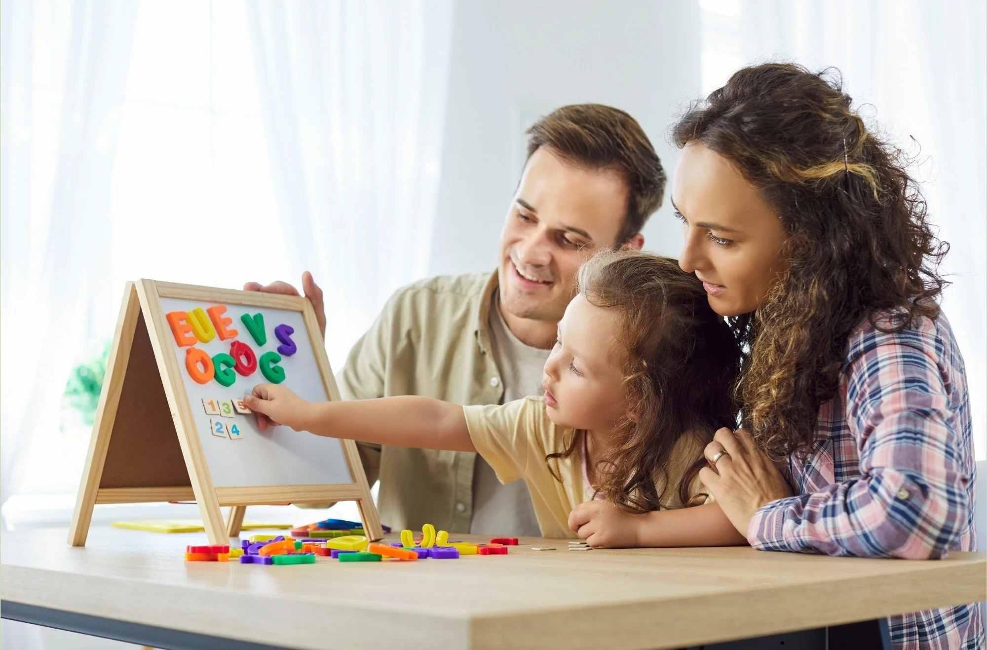 Parents and child interacting during a personalized caregiver support session for families in Thomasville, Davidson County, and Forsyth County, NC.