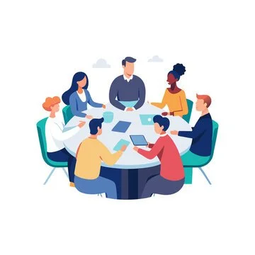 Group of six diverse people seated around a table, engaged in a meeting or discussion.