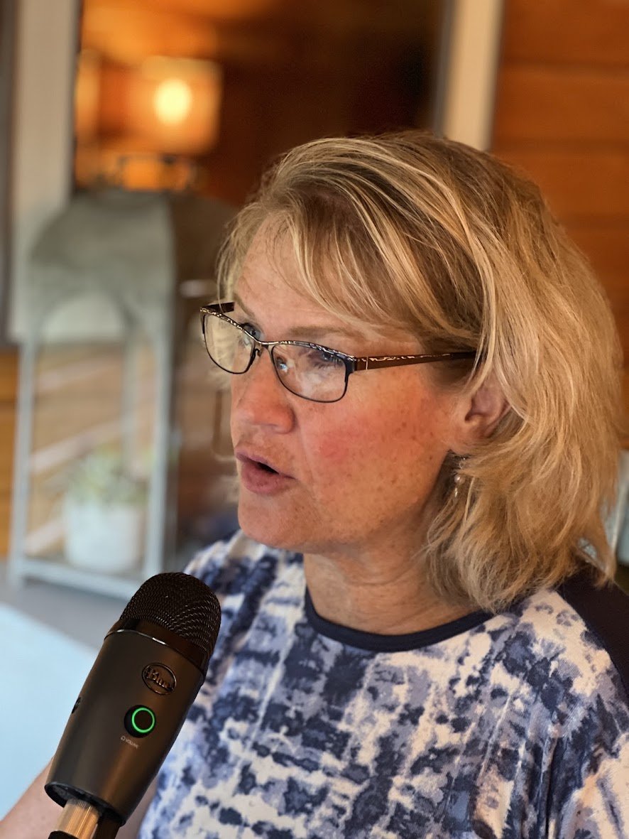 Christy speaking in front of camera