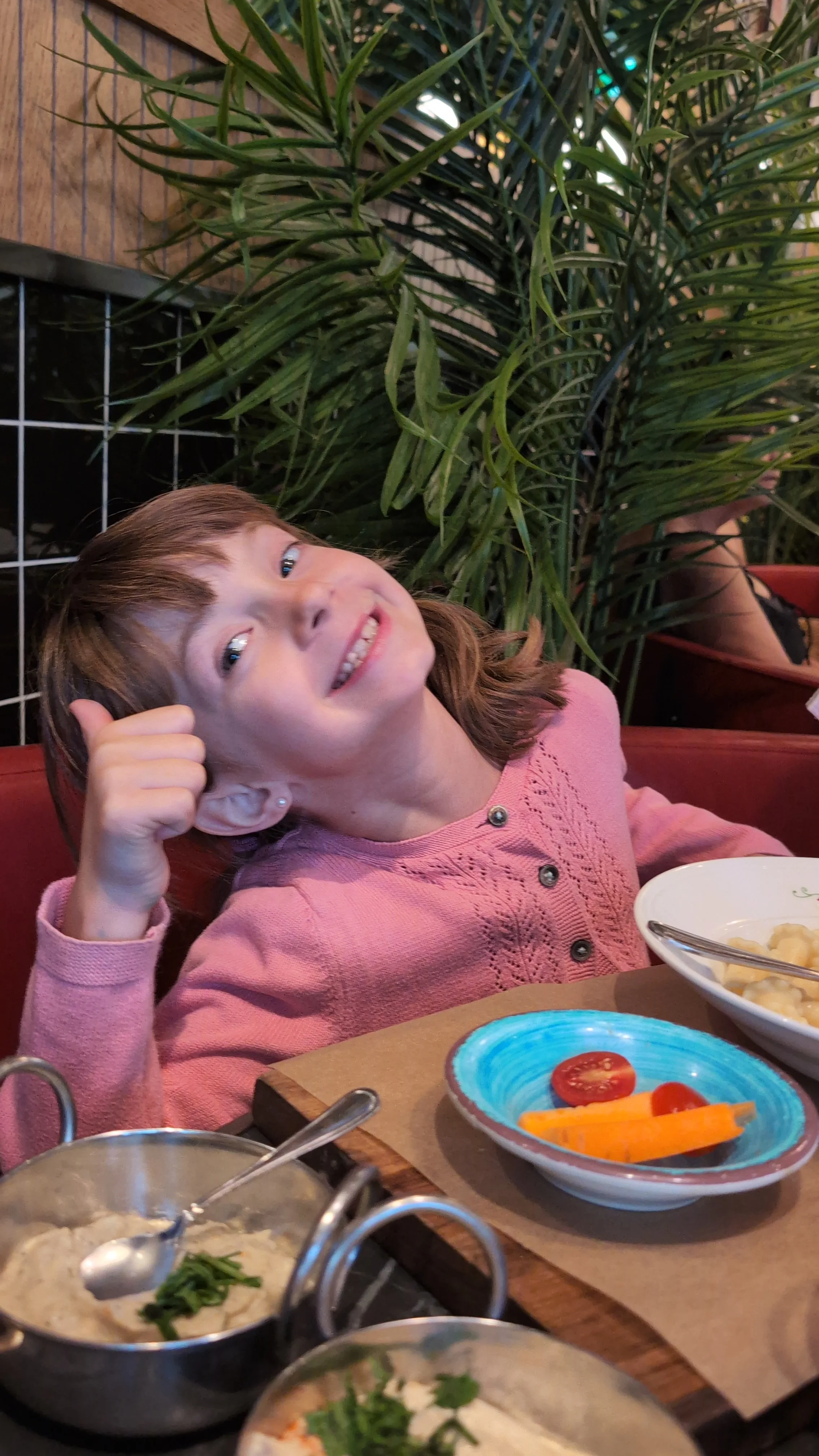 My sister giving her Cafe Landwer Butter Noodles a thumbs up!