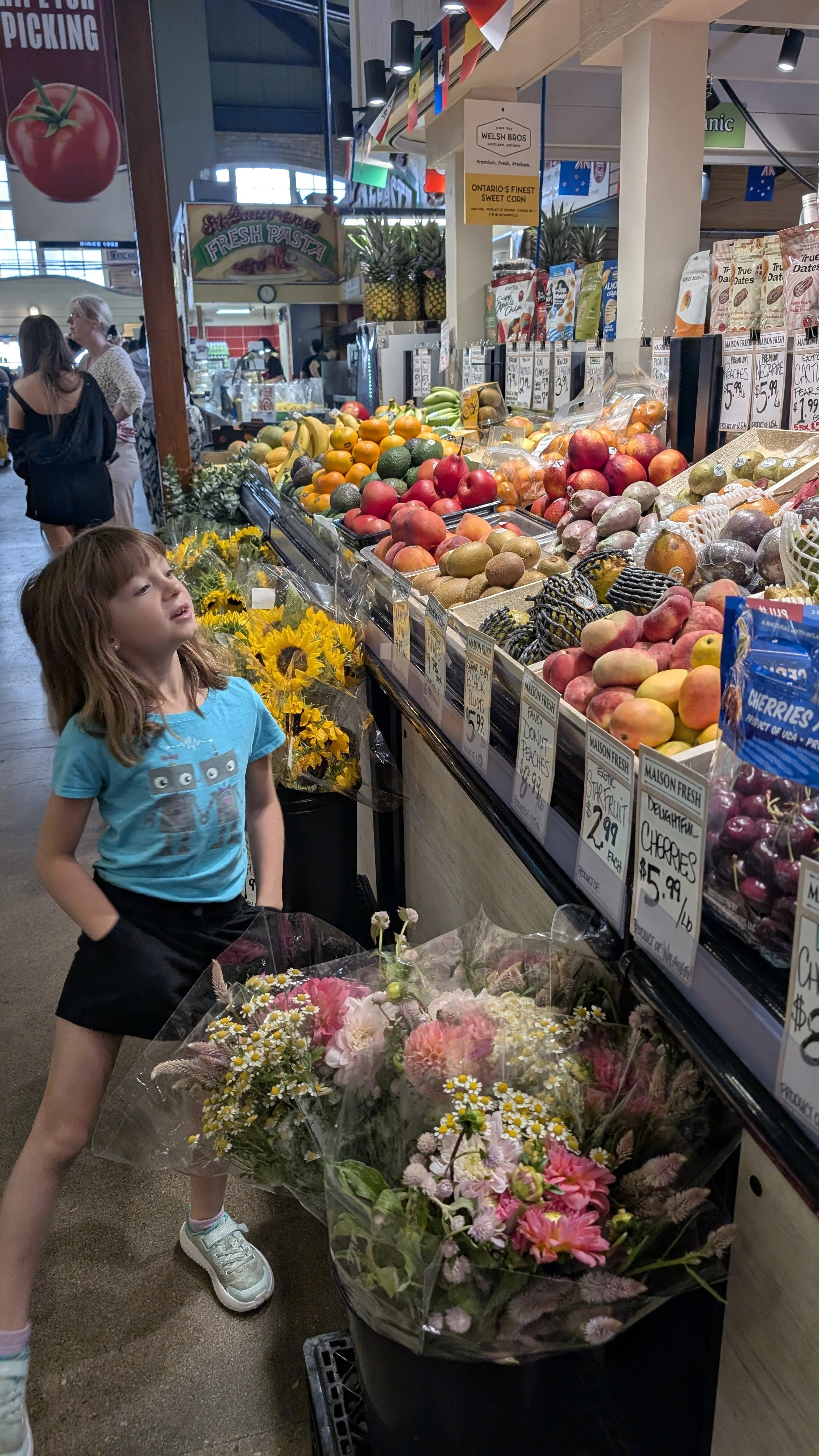 My sister looking at the fruit