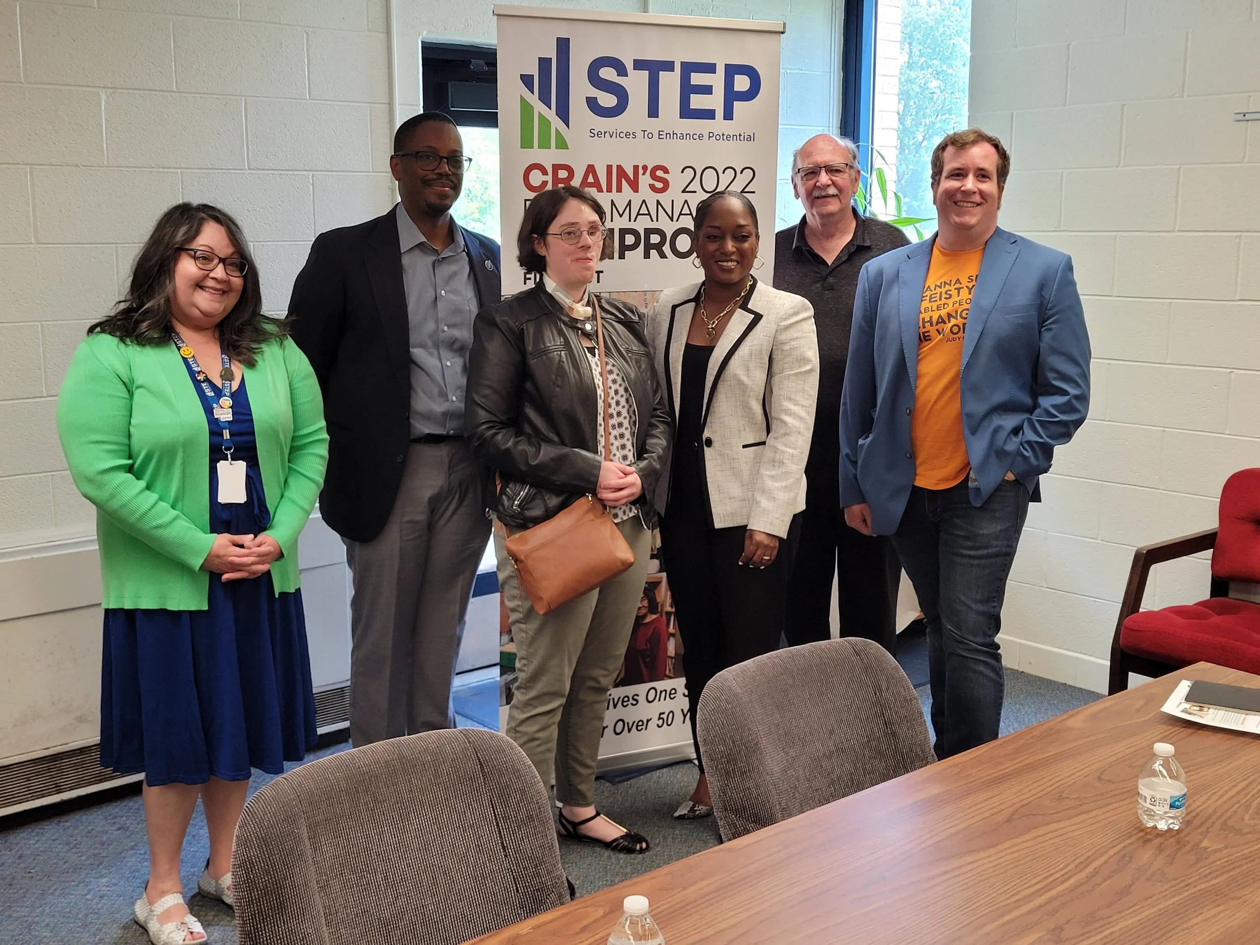 Alan with a group of people at an event for STEP.