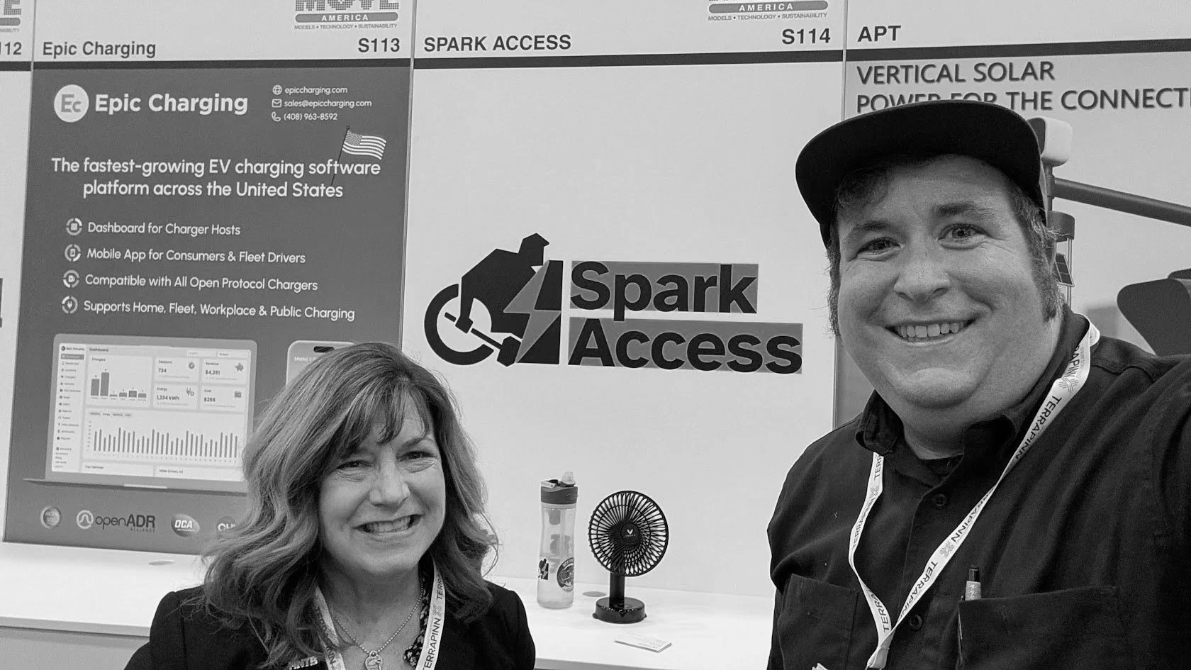 Alan Hejl standing next to a smiling woman at a Spark Access booth.