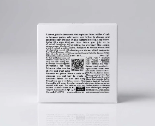 Back of a white product box with text and symbols related to a plastic-free, eco-friendly shower cube.