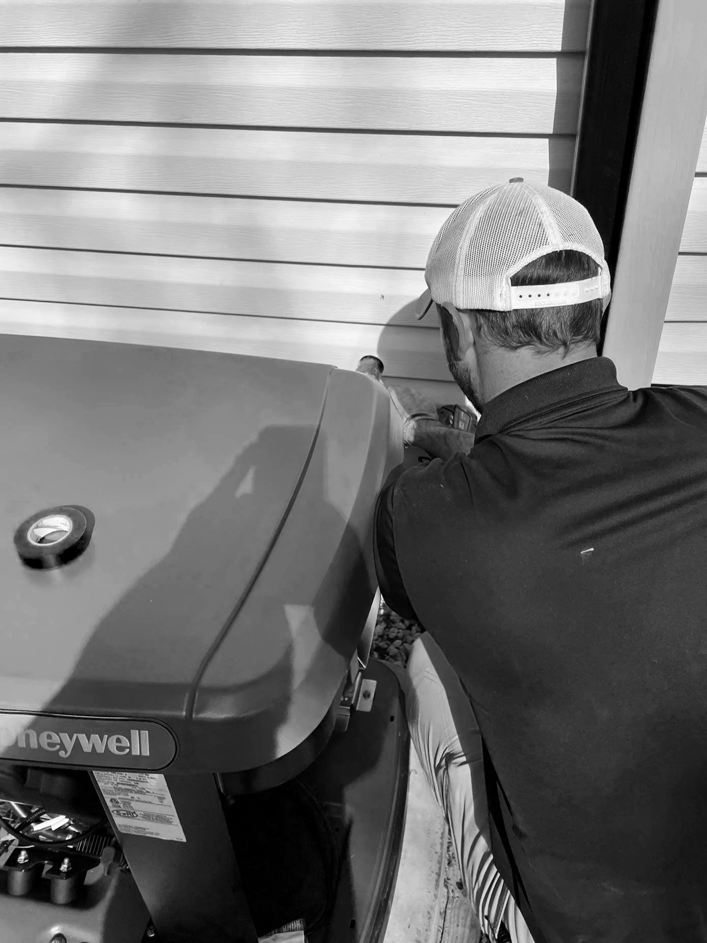A local Alabama electrician installing a generator and performing a tune up on a generator.