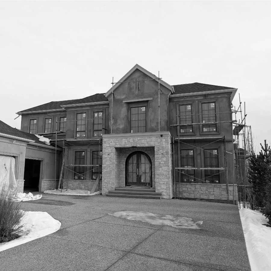 A house under construction, exterior view.