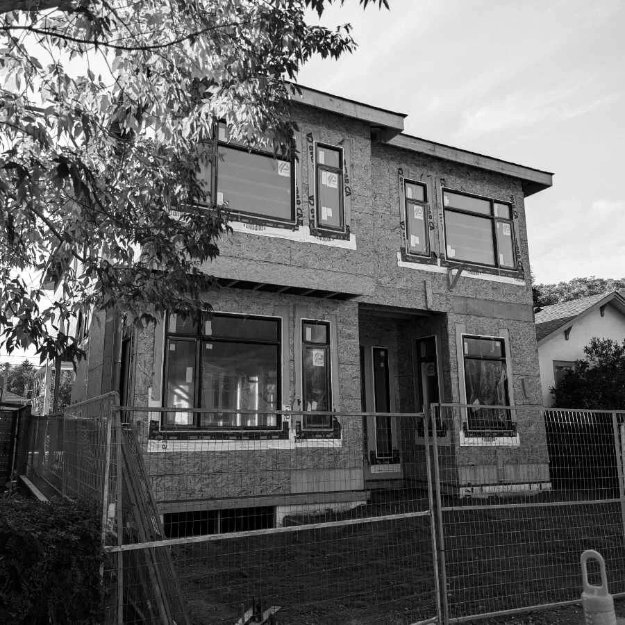 A house under construction, exterior view.