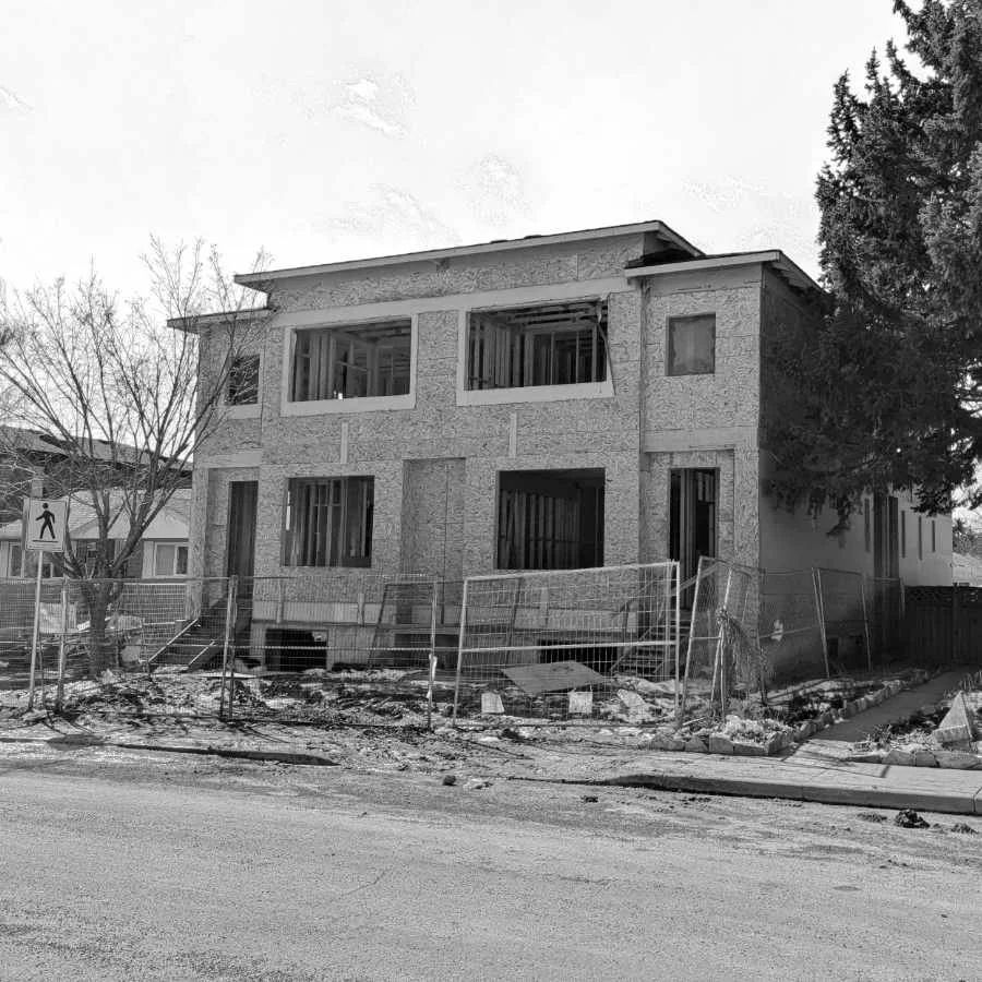 A house under construction, exterior view.