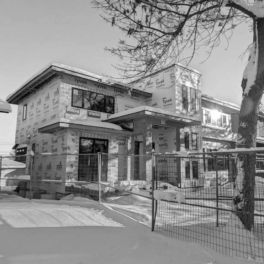 A house under construction, exterior view.