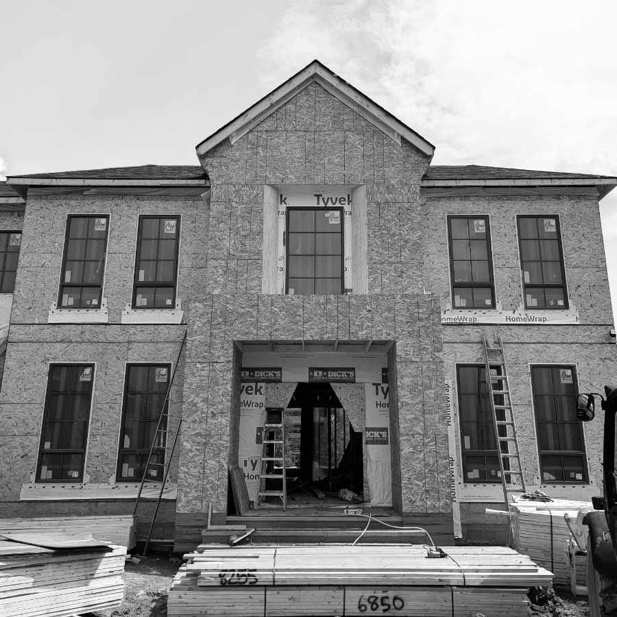 A house under construction, exterior view.