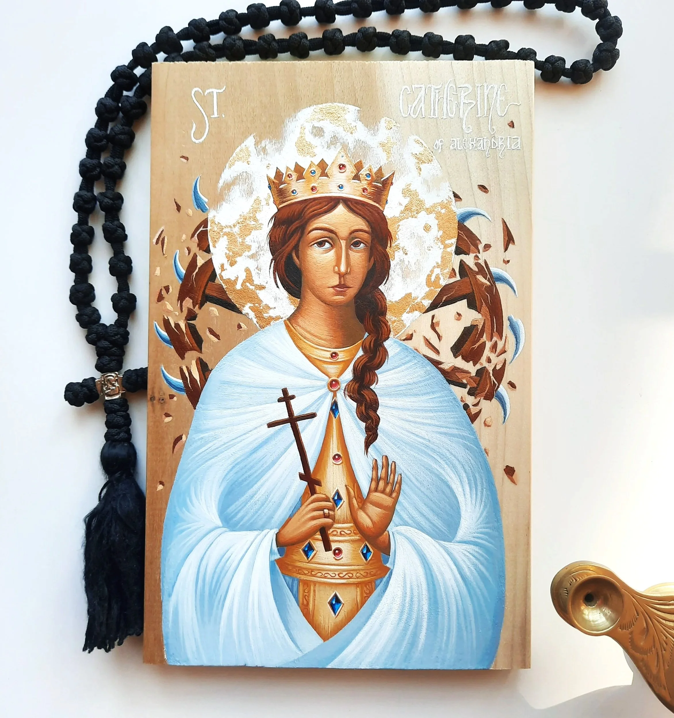 Saint Catherine of Alexandria.
8.5 x 5.5 x 0.75 inches (14 x 21.5 x 2cm), acrylic paint and golden metal leaf on wood panel, 2022. Privately commissioned icon.