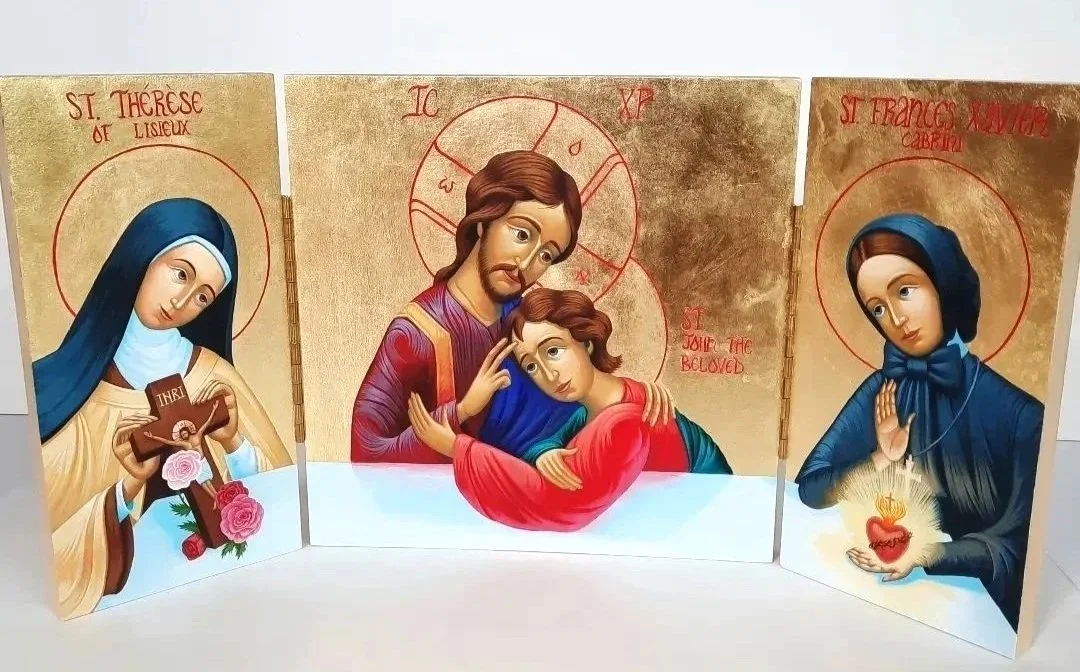 Triptych Icon of Saint Therese of Lisieux, Our Lord Jesus Christ, Saint John the Beloved, and Saint Frances Xavier Cabrini.
11.25 x 22.5 x 0.75 inches (28.5 x 57 x 2cm), acrylic and gold leaf on wood panel. 2023. Privately commissioned icon.
