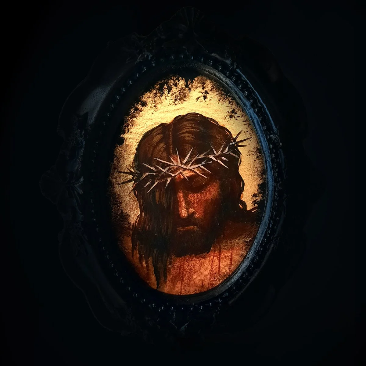 A neoclassical icon depicting Jesus Christ wearing a crown of thorns, with a glowing halo around his head.