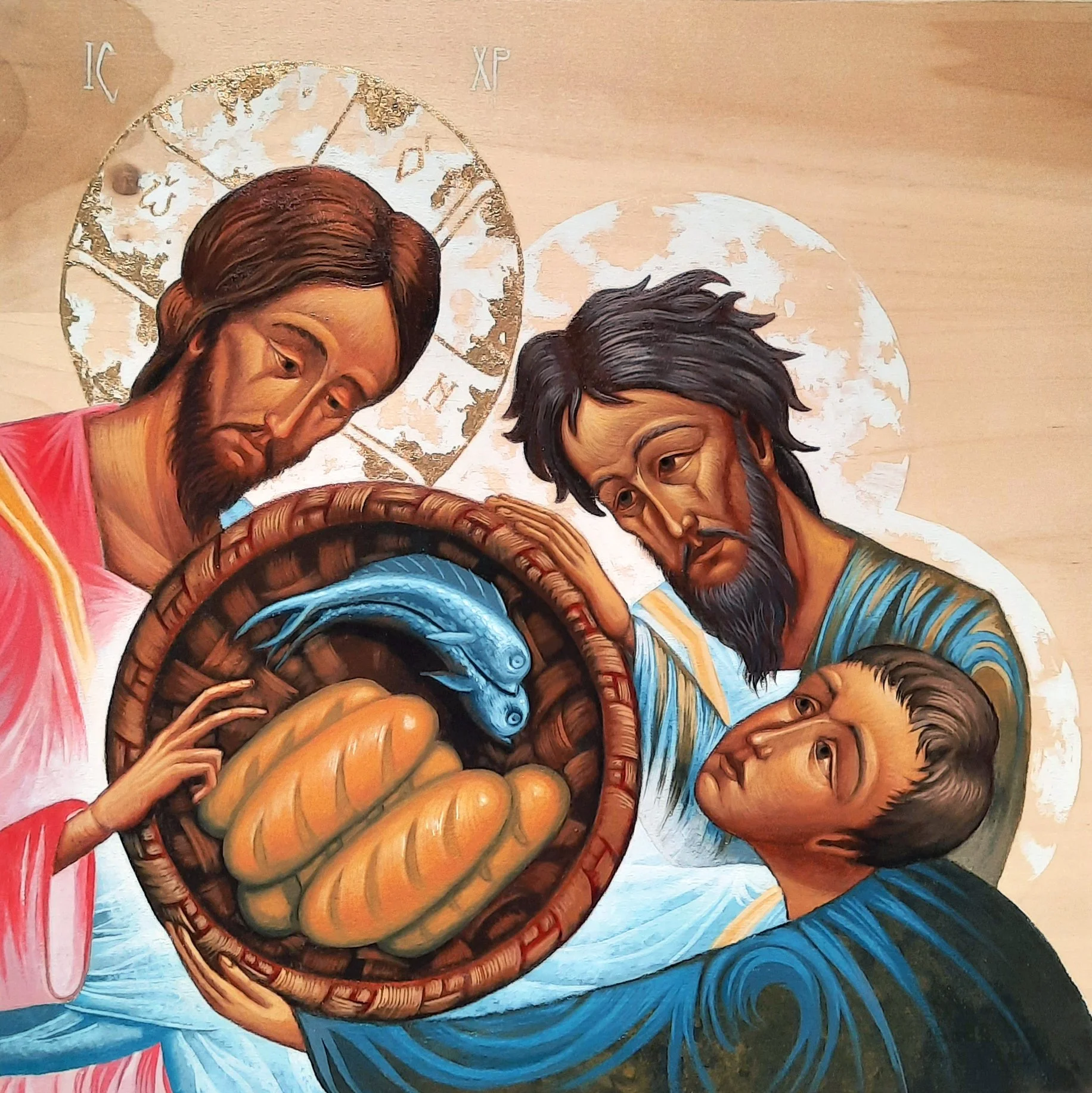 Five Loaves and Two Fishes with Jesus Christ and the Apostles Andrew and Philip - Feeding the 5,000.
12 x 12 x 0.75 inches (30.5 x 30.5 x 2cm), acrylic paint and golden metal leaf on wood panel, 2021. Privately commissioned icon.